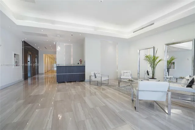a living room with couches and a potted plant on coffee table
