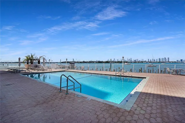 a view of a lake with outdoor seating