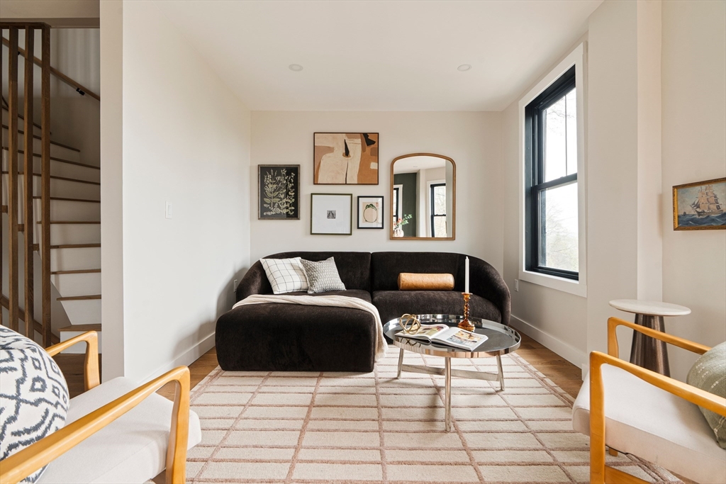 16 Yale Terrace, Unit 2 Boston, MA 02130 - Photo 17 of 32 a living room with furniture and large windows