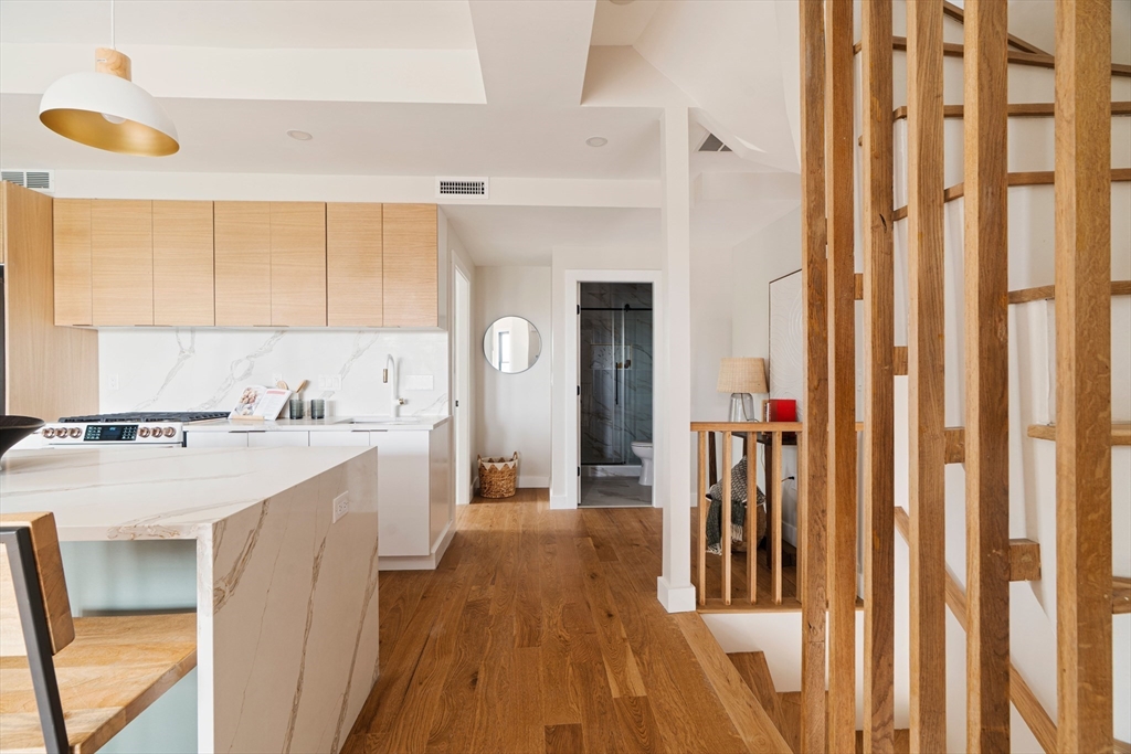 16 Yale Terrace, Unit 2 Boston, MA 02130 - Photo 18 of 32 a view of a kitchen with a sink and dishwasher a refrigerator with wooden floor