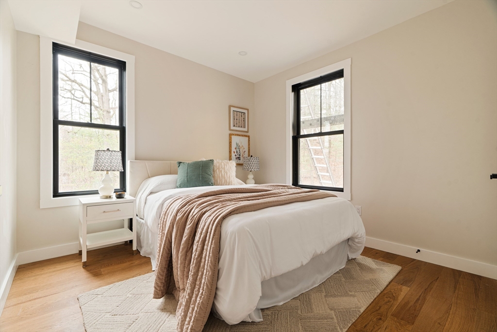 16 Yale Terrace, Unit 2 Boston, MA 02130 - Photo 19 of 32 a bedroom with a bed and a window