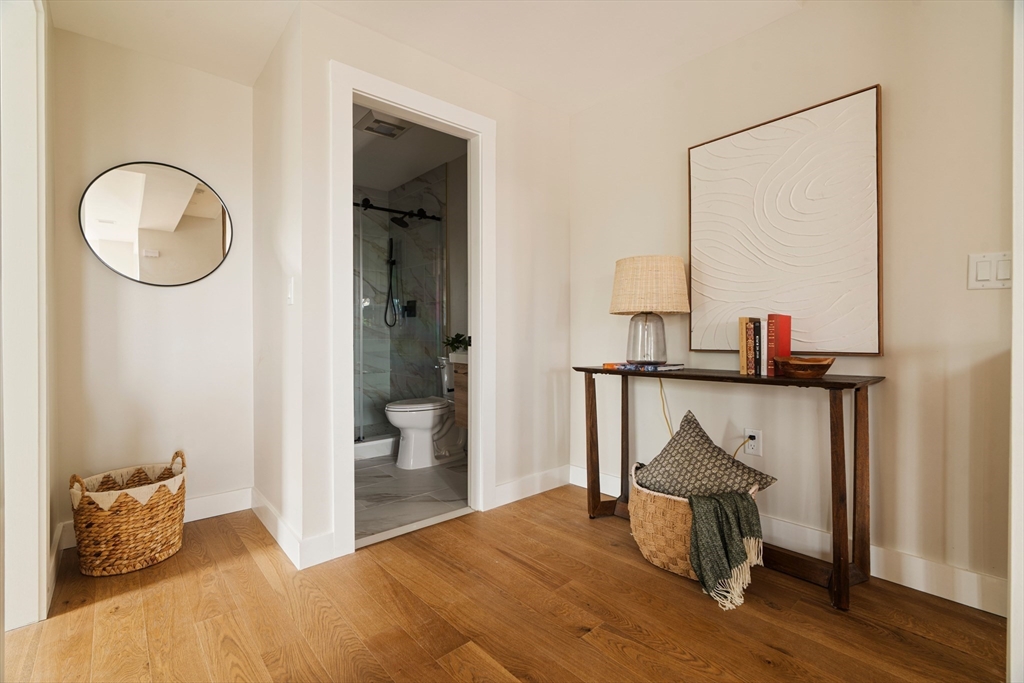 16 Yale Terrace, Unit 2 Boston, MA 02130 - Photo 20 of 32 a bedroom with a bed and wooden floor