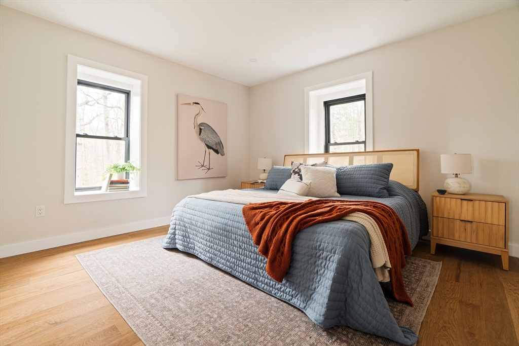 16 Yale Terrace, Unit 2 Boston, MA 02130 - Photo 22 of 32 a bedroom with a bed and window