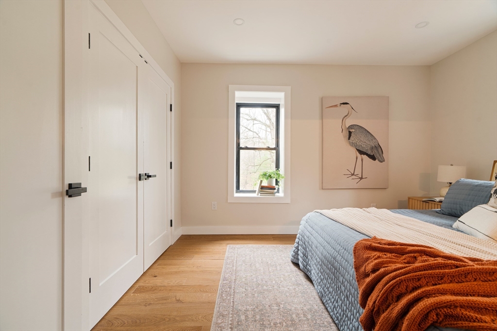 16 Yale Terrace, Unit 2 Boston, MA 02130 - Photo 23 of 32 a bedroom with a bed and a window