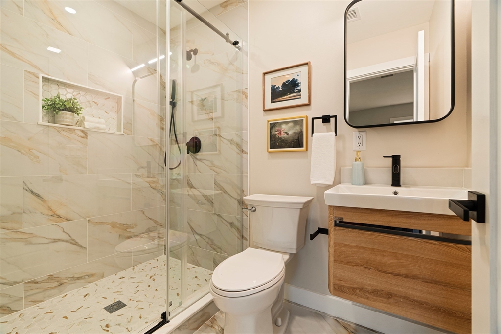 16 Yale Terrace, Unit 2 Boston, MA 02130 - Photo 27 of 32 a bathroom with a sink toilet and shower