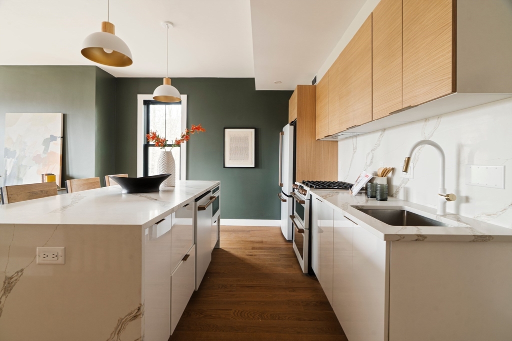 16 Yale Terrace, Unit 2 Boston, MA 02130 - Photo 4 of 32 a kitchen with sink a mirror and window