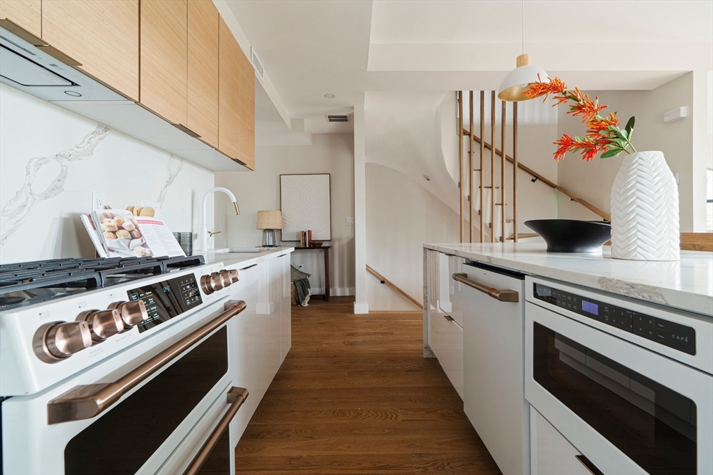 16 Yale Terrace, Unit 2 Boston, MA 02130 - Photo 6 of 32 a kitchen with a stove and a wooden floor