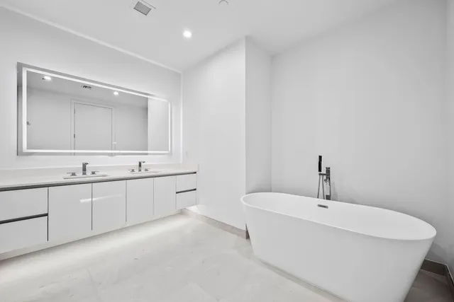 a bathroom with a sink and a bathtub