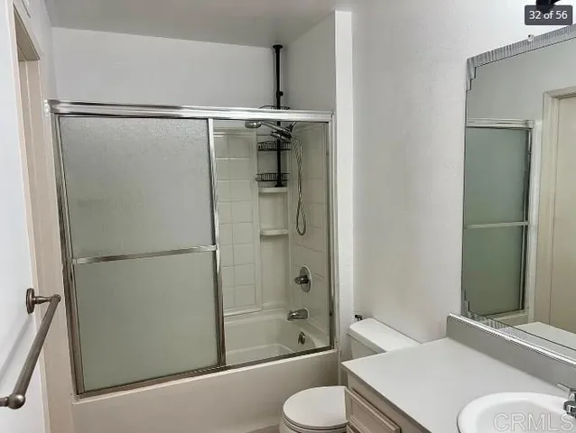 a bathroom with a shower and a toilet