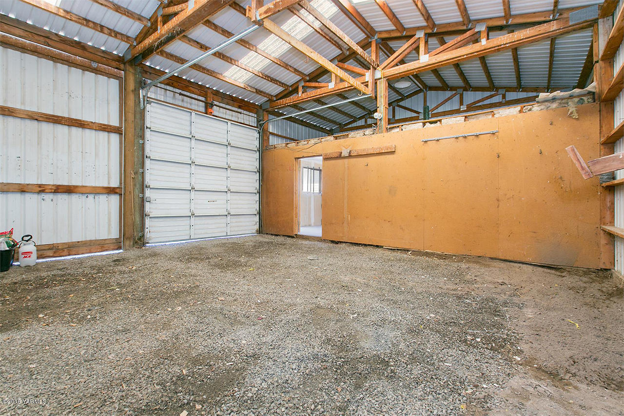 71 Sheep Company Road Selah, WA 98942 - Photo 16 of 19 a view of a room with wooden walls