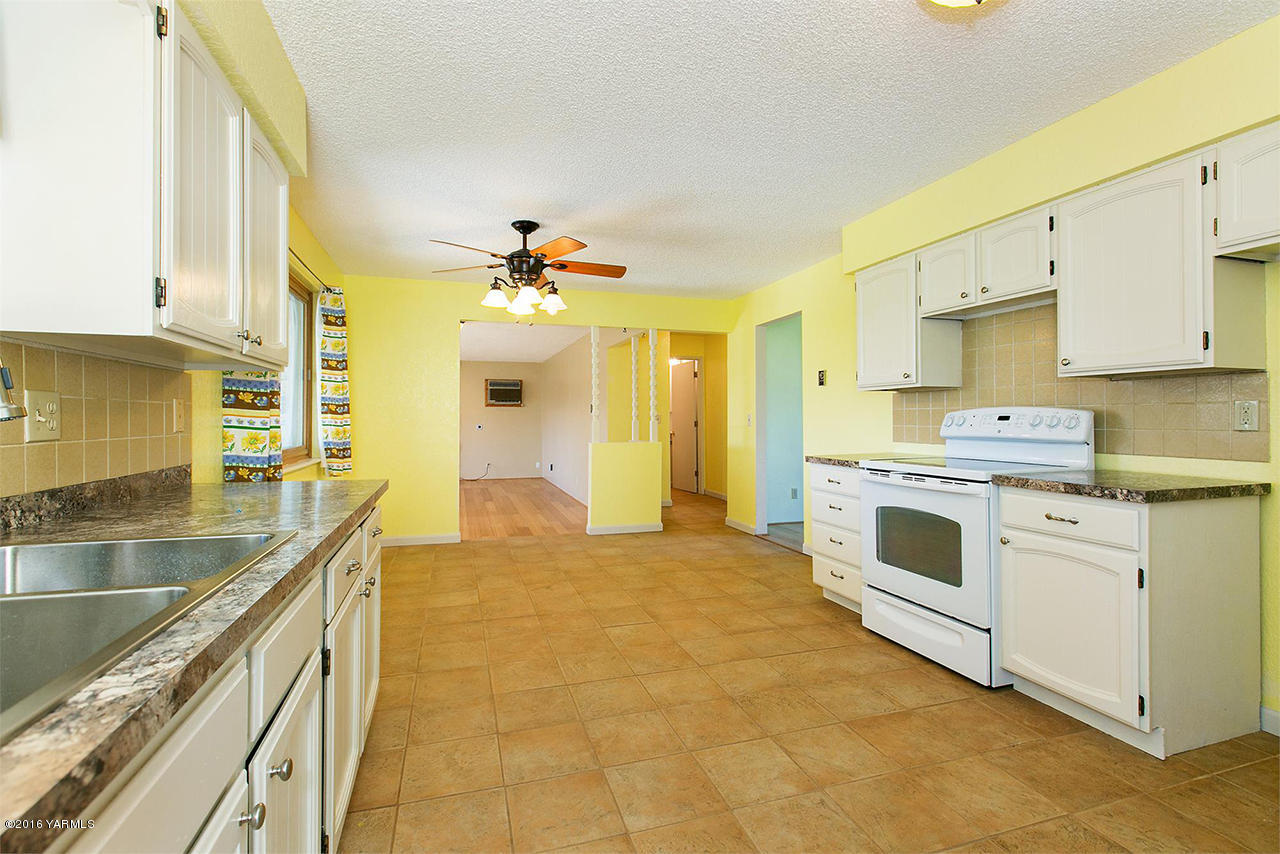 71 Sheep Company Road Selah, WA 98942 - Photo 6 of 19 a kitchen with a sink cabinets and window