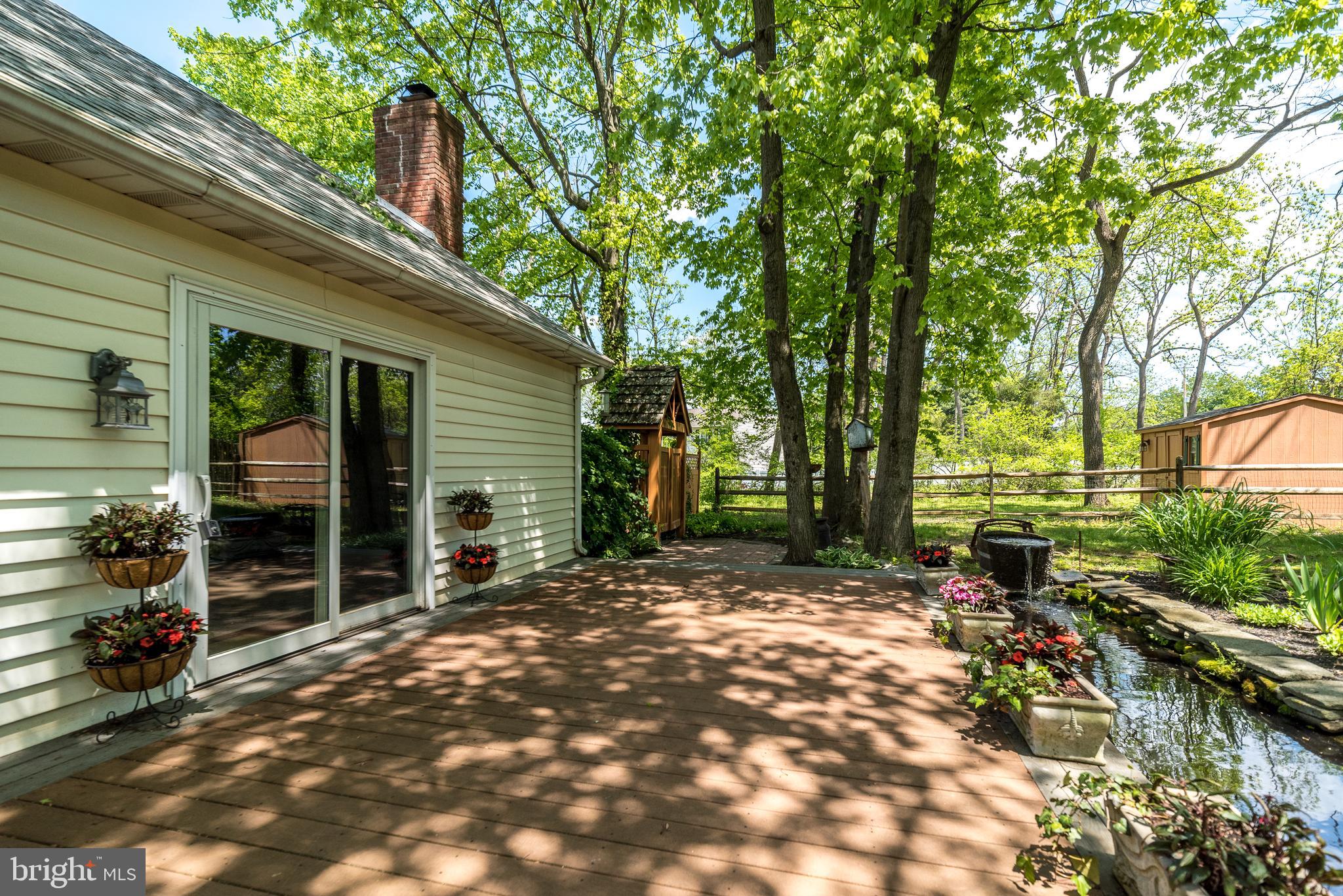 227 Knapp Road Lansdale, PA 19446 - Photo 35 of 41 Deck with pond