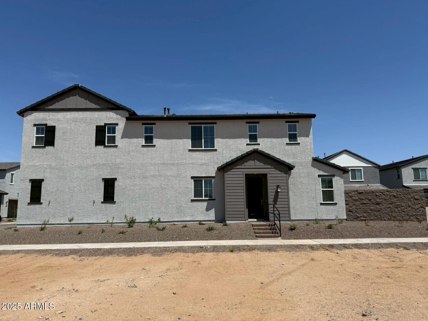 2443 West Rowel Road Phoenix, AZ 85085 - Photo 4 of 19 a front view of a house with a yard