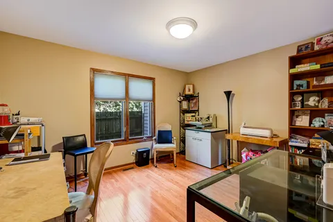 a view of a workspace with furniture and a living room