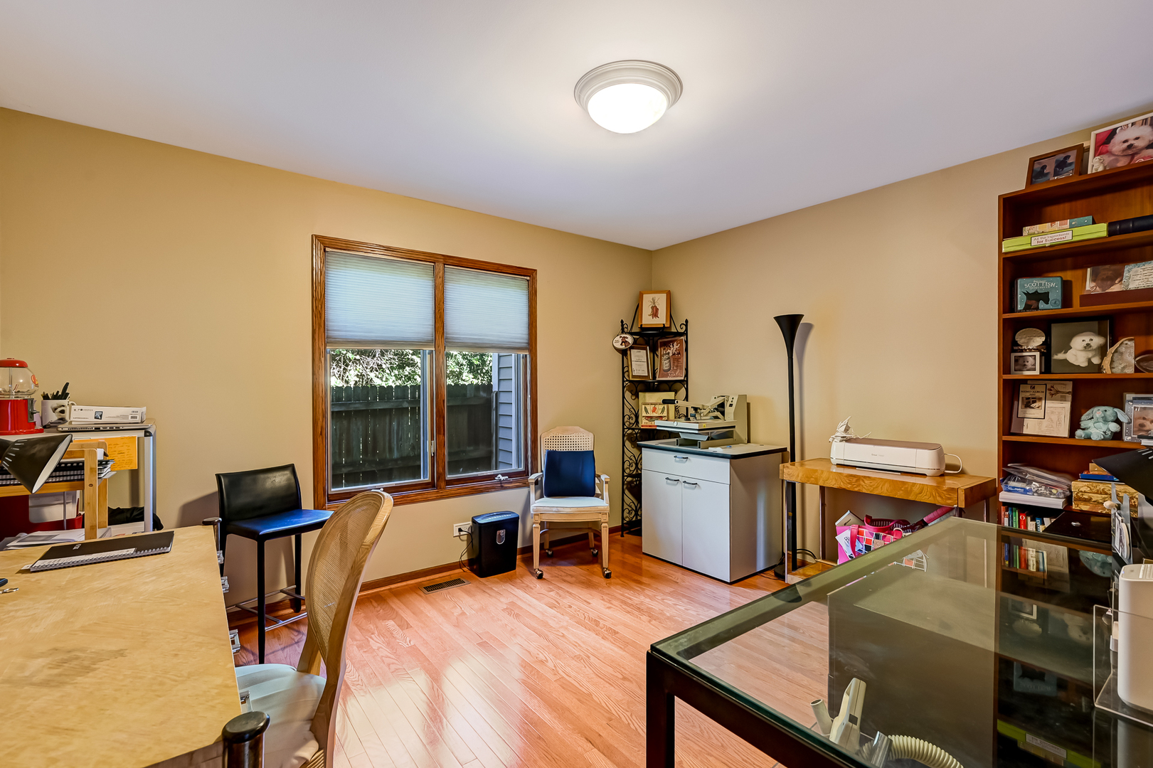 8826 Carlisle Court Darien, IL 60561 - Photo 14 of 36 a view of a workspace with furniture and a living room
