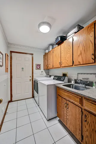 a kitchen with a stove top oven sink and cabinets