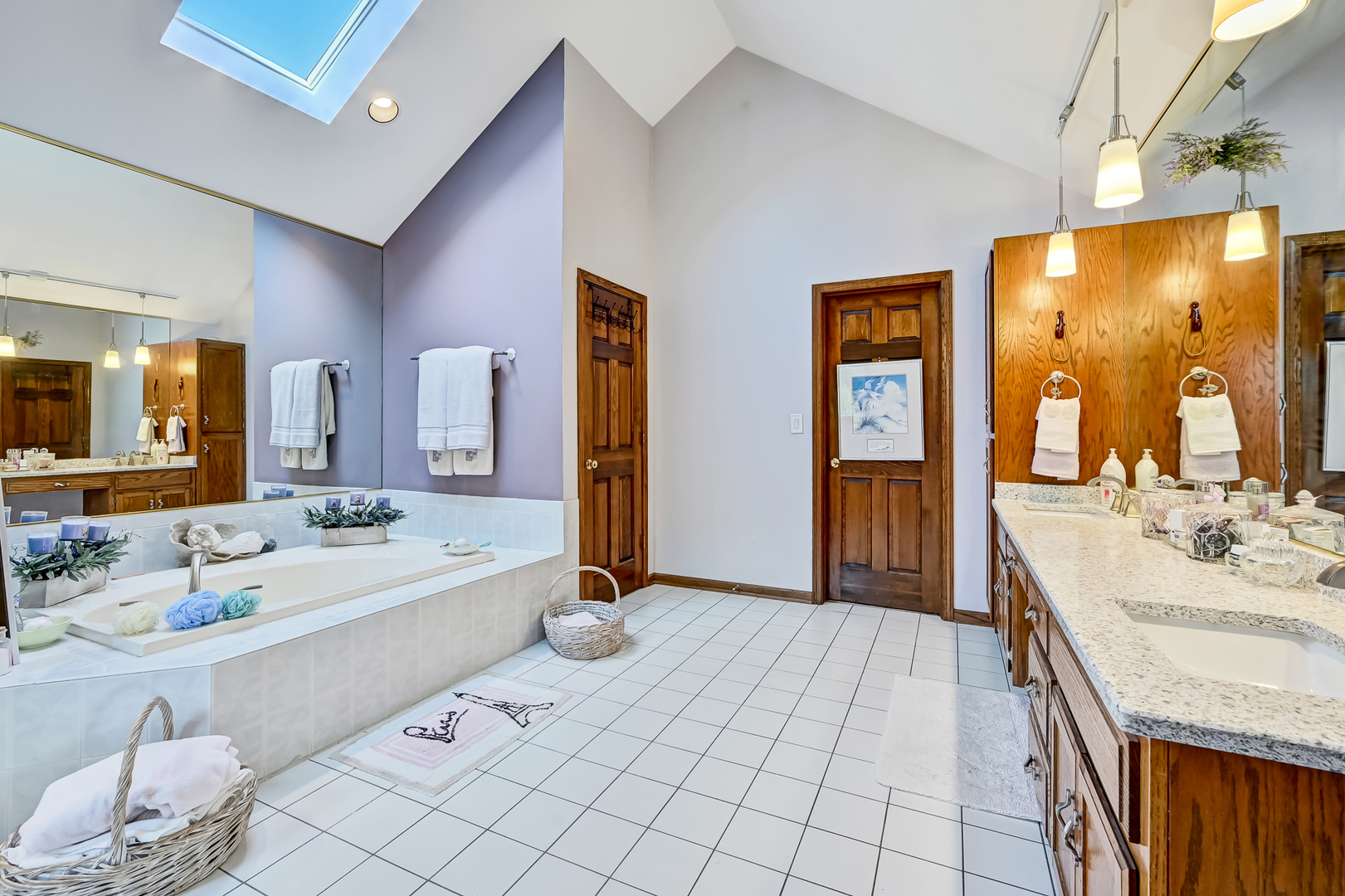 8826 Carlisle Court Darien, IL 60561 - Photo 19 of 36 a spacious bathroom with a double vanity sink and a mirror