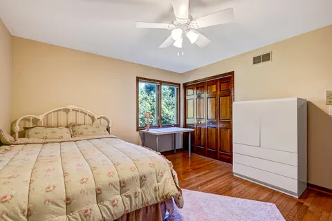 a bedroom with a bed and a table