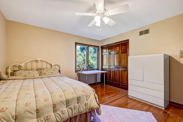 a bedroom with a bed and a table