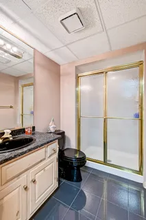 a kitchen with a sink and a stove top oven