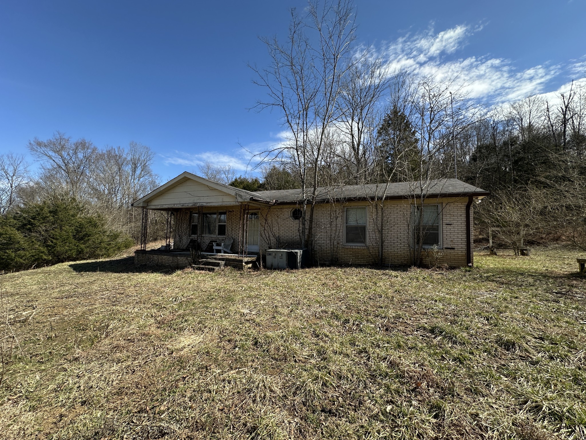 328 Buffalo Road Carthage, TN 37030 - Photo 5 of 30 a front view of house with yard and trees in the background