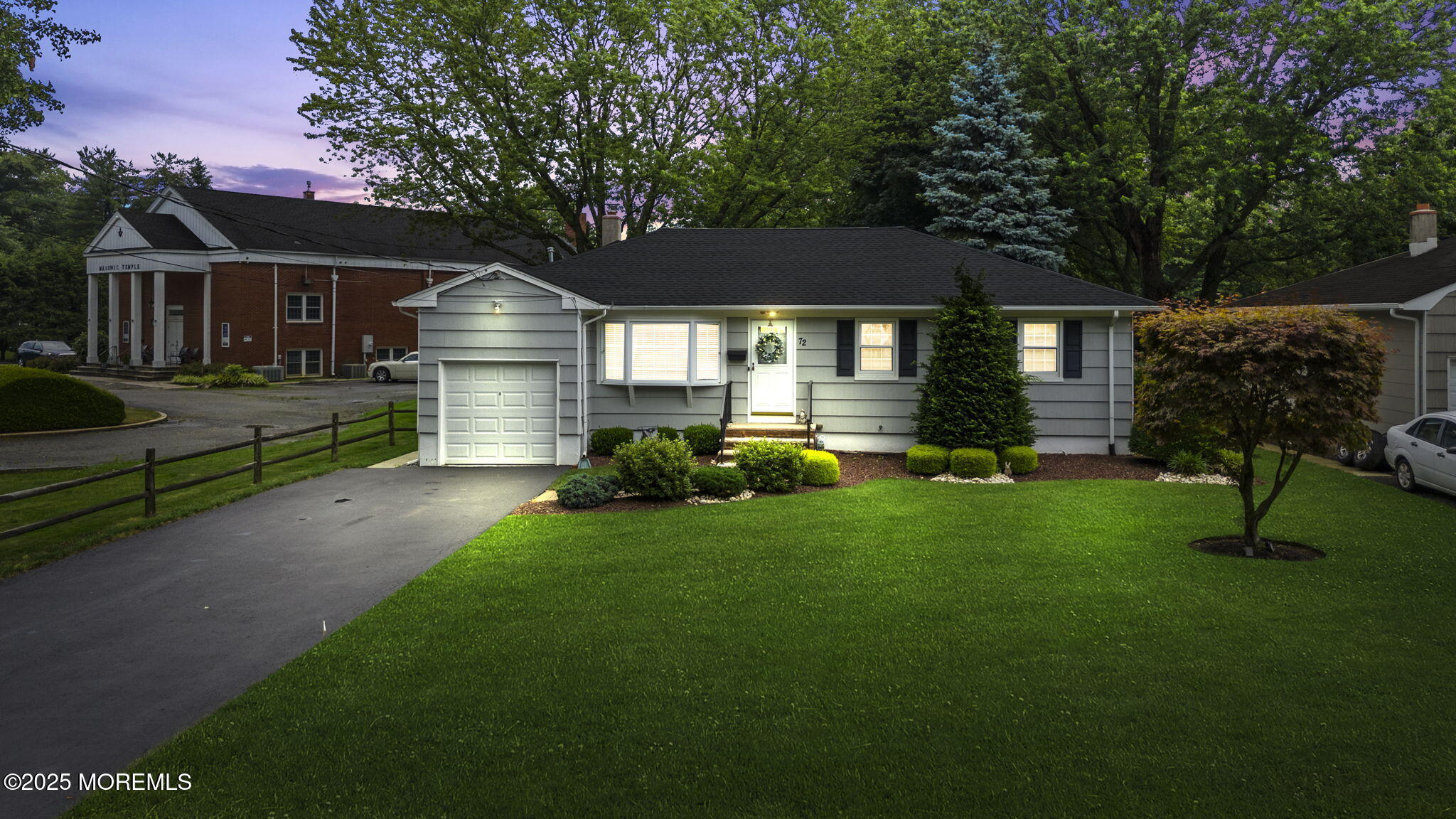 a front view of a house with a yard