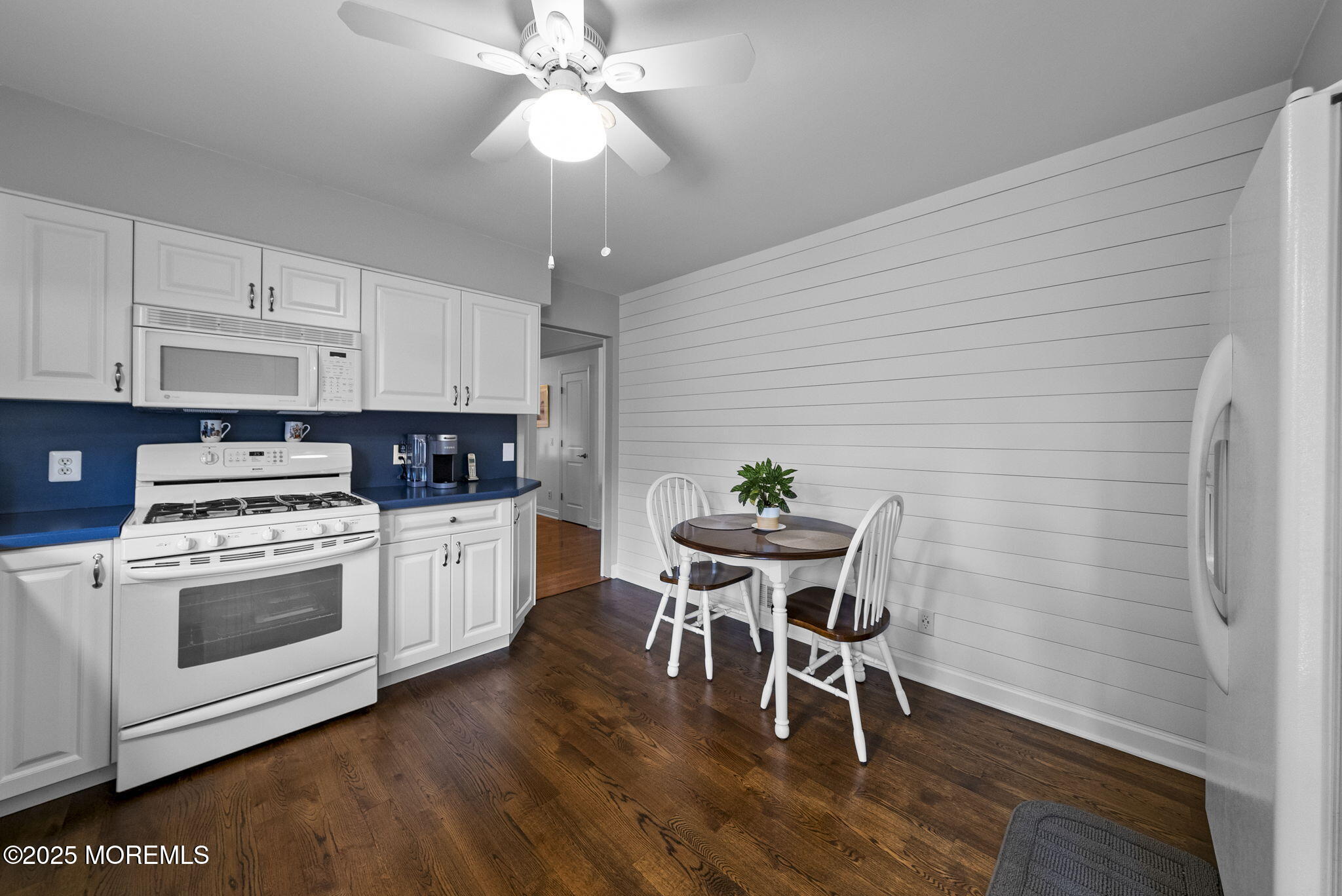 72 Broadway Road Freehold, NJ 07728 - Photo 16 of 37 a kitchen with stainless steel appliances a white wooden cabinets and stove top oven