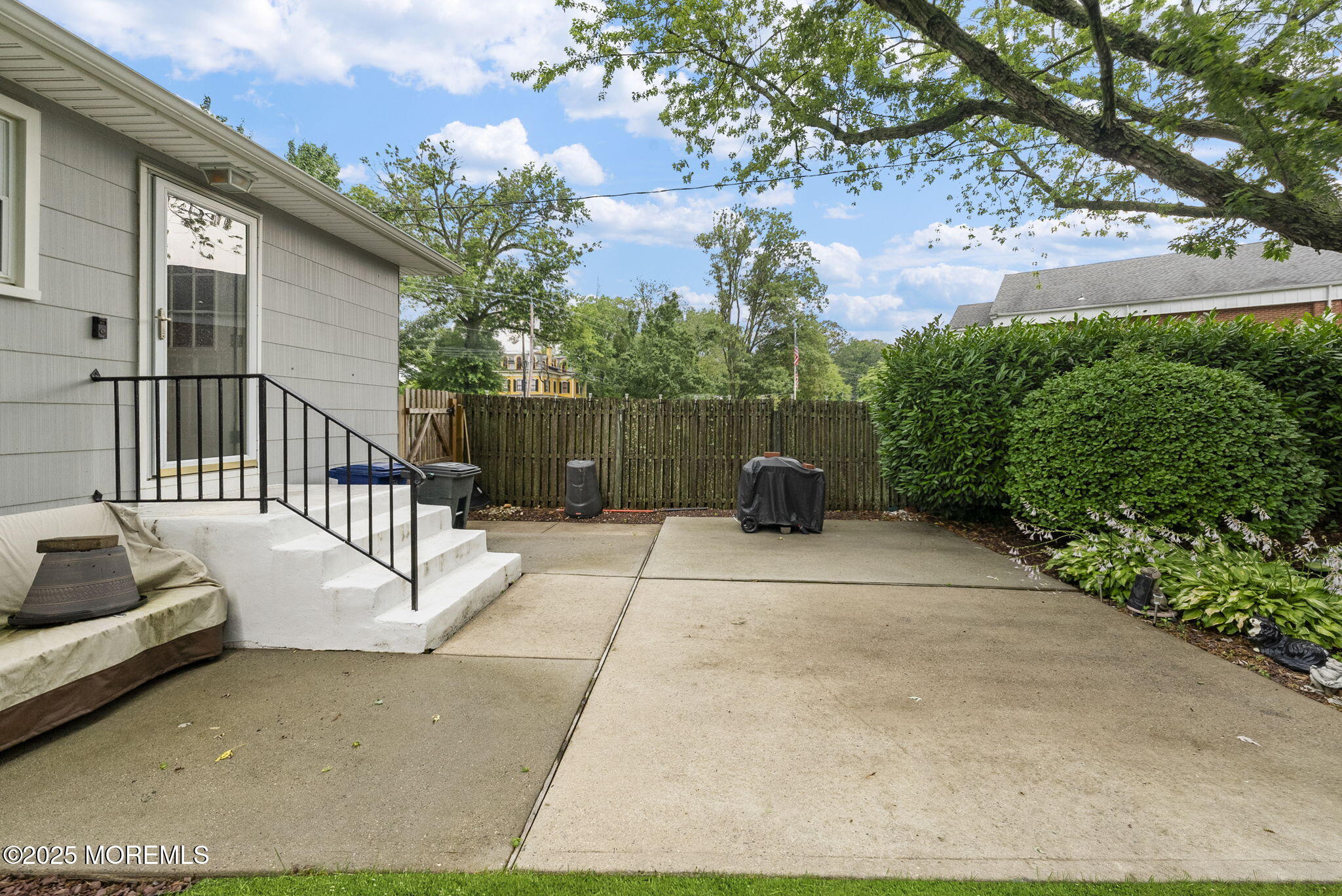 72 Broadway Road Freehold, NJ 07728 - Photo 28 of 37 a view of a chair and tables in the patio