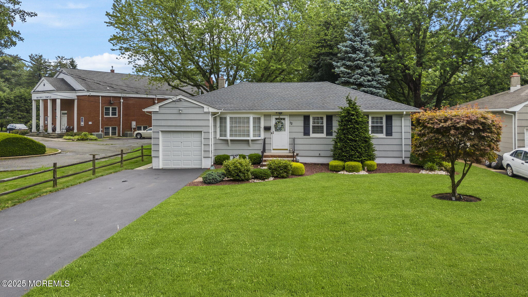 72 Broadway Road Freehold, NJ 07728 - Photo 37 of 37 a front view of a house with a yard and green space
