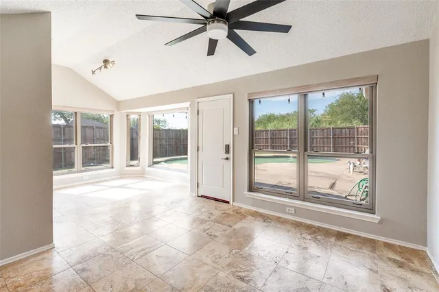 a view of an empty room with a window