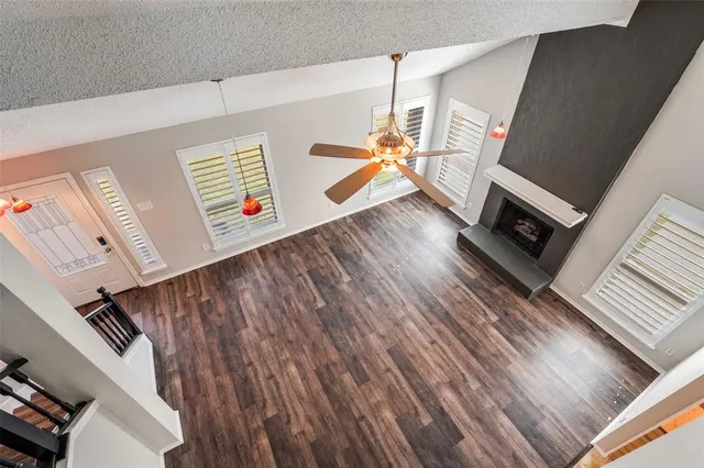 a view of an entryway with wooden floor
