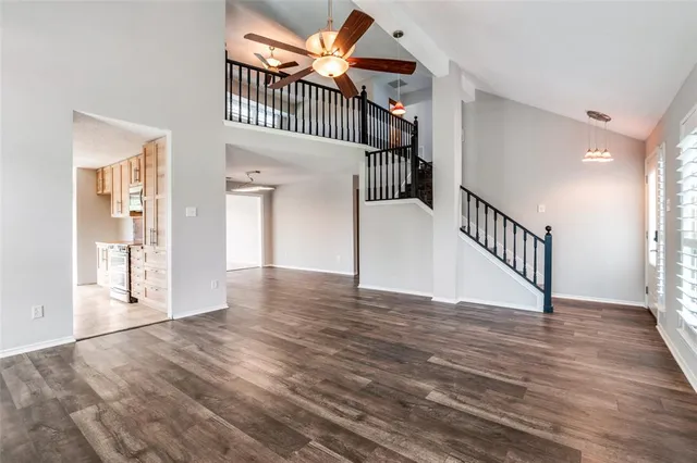 a view of an entryway with wooden floor