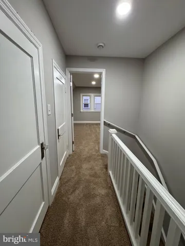 a backyard of a house with yard and trampoline