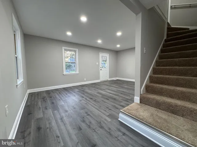 a bathroom with a sink a toilet a mirror and vanity