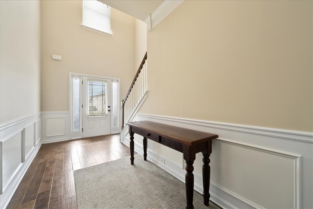 153 Border Avenue Simpsonville, SC 29680 - Photo 16 of 30 This inviting foyer features gleaming wood flooring and wainscoting, setting a refined tone for the home.