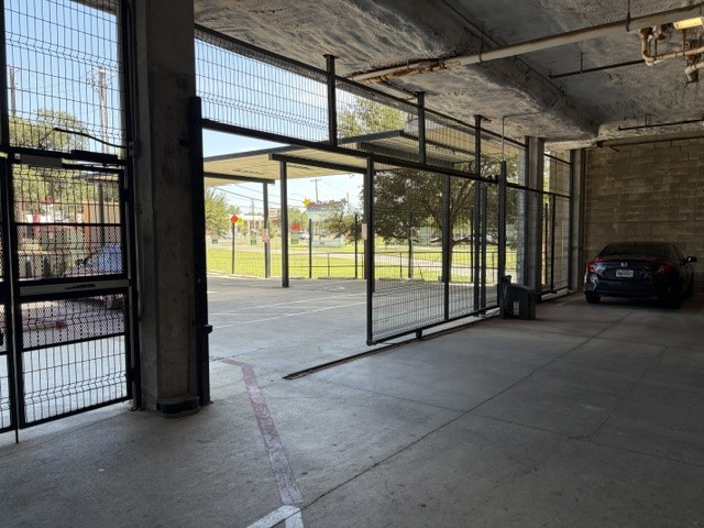 6444 Burnet Road, Unit 201 Austin, TX 78757 - Photo 14 of 18 A spacious, enclosed parking garage offers secure, protected vehicle storage.