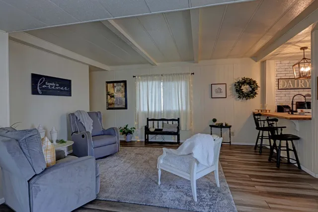 a living room with furniture and a lamp