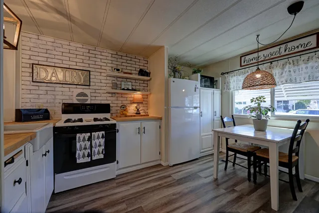 a kitchen with cabinets a sink and appliances