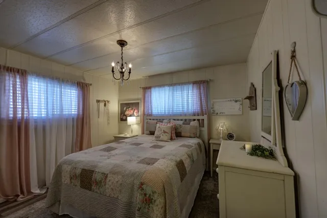 a bedroom with a bed and window