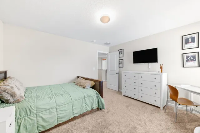 a view of living room filled with furniture and wooden floor