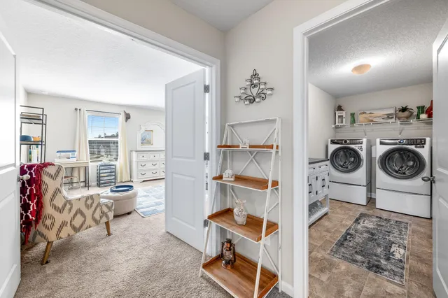 a view of living room with furniture and a flat screen tv