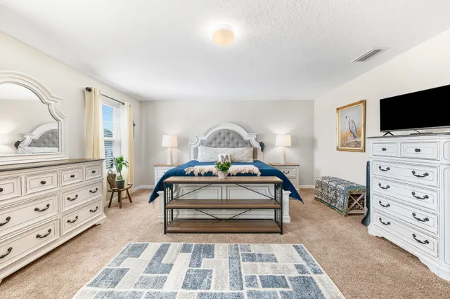 a view of a livingroom with workspace and a couch