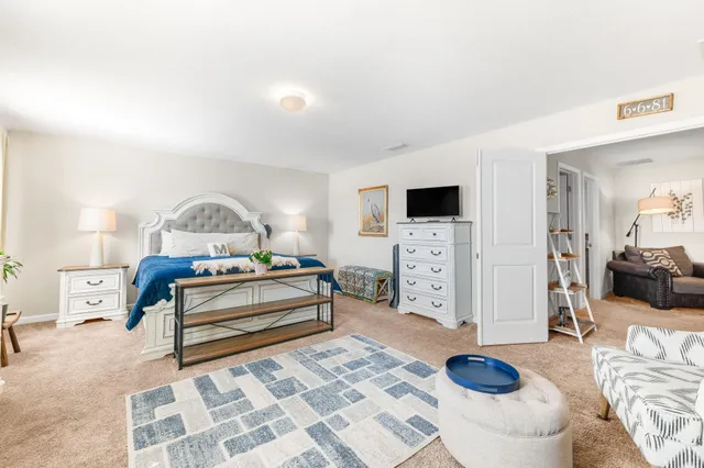 a view of a kitchen with fridge and workspace