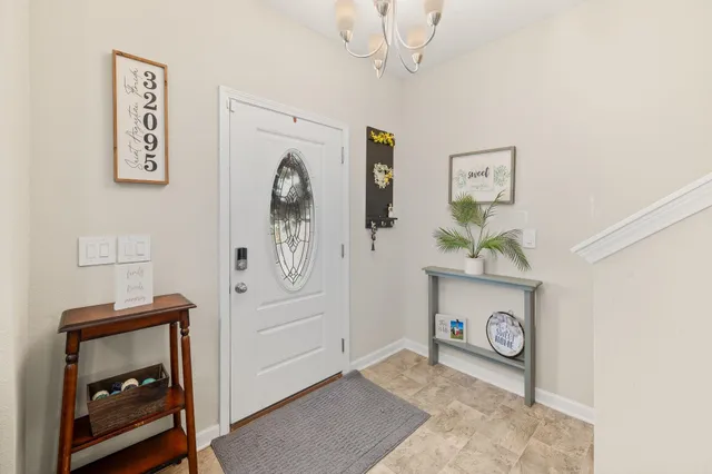 a living room with furniture and a stair