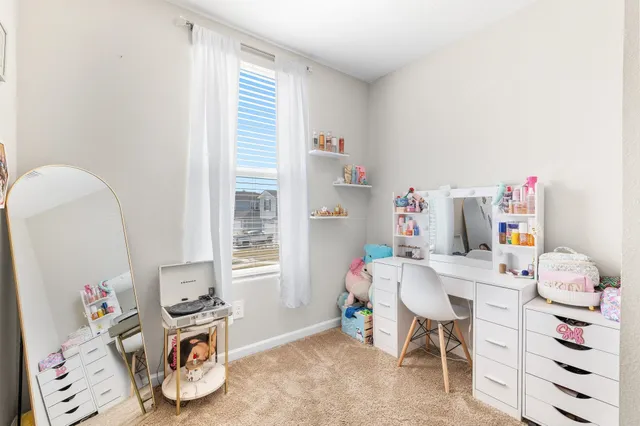 a kitchen with a sink a refrigerator and cabinets