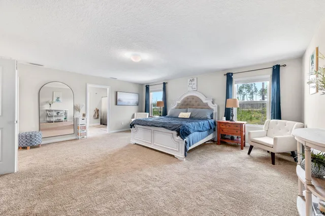 a view of swimming pool with outdoor seating and plants