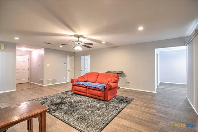 a living room with furniture and a rug