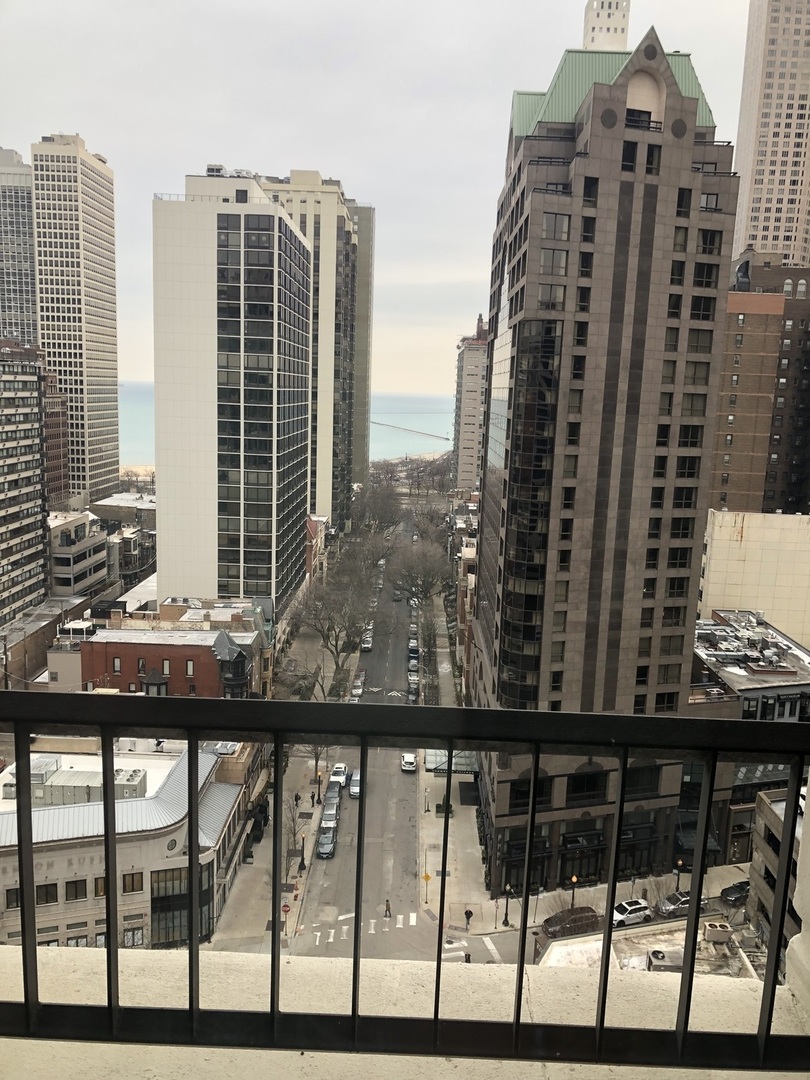 1030 North State Street, Unit 11G Chicago, IL 60610 - Photo 23 of 23 a view of balcony with a couple of chairs