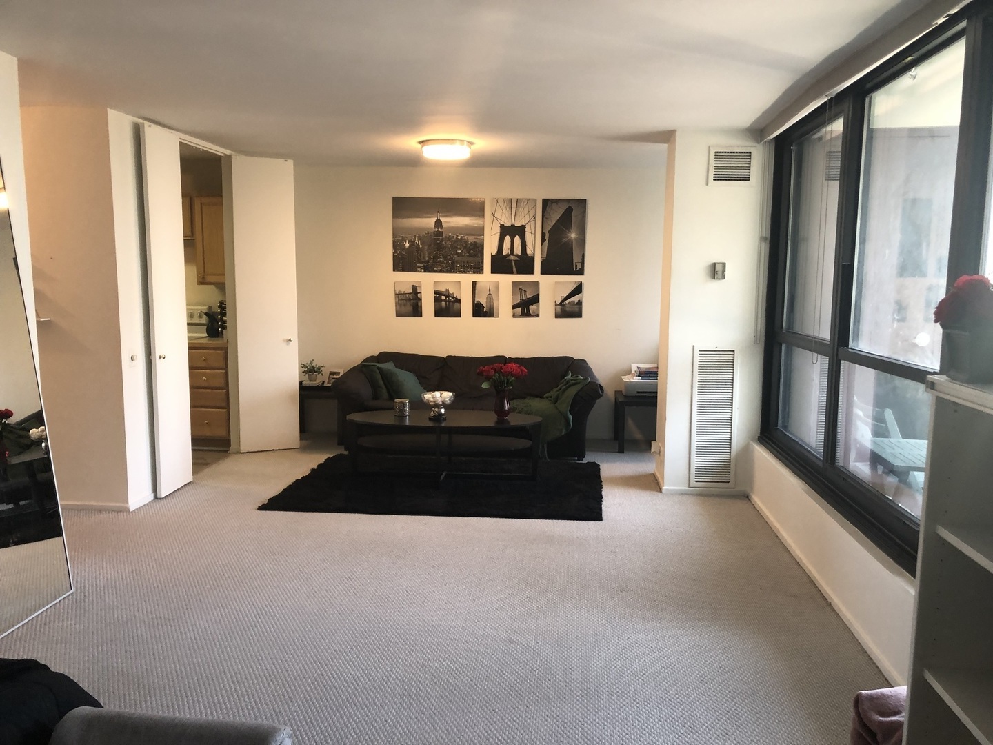 1030 North State Street, Unit 11G Chicago, IL 60610 - Photo 6 of 23 a living room with furniture and a large window