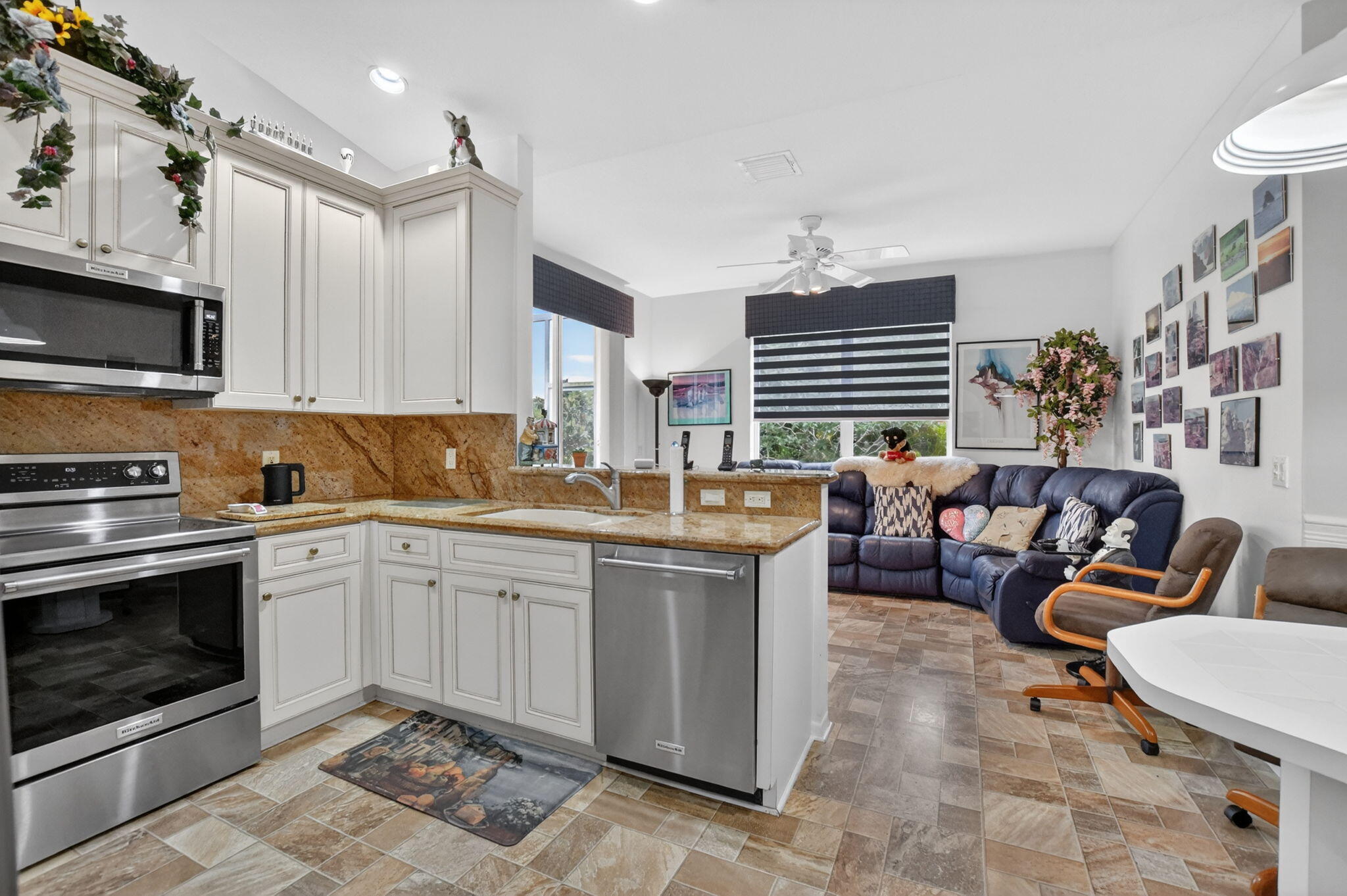 23478 Torre Circle Boca Raton, FL 33433 - Photo 10 of 44 Kitchen and family room